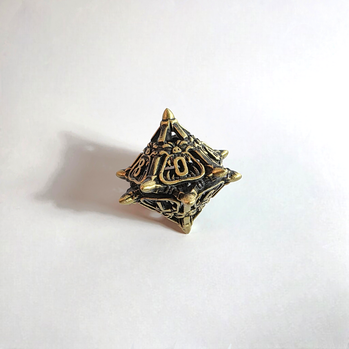 Snarling Mimic Antique Gold Hollow Metal Dice Set