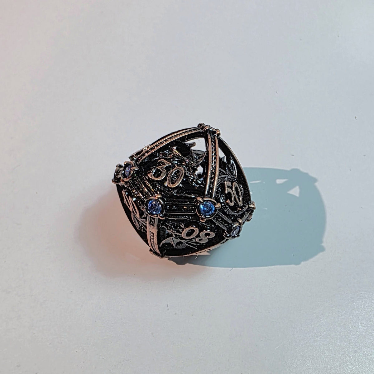 Brass Sapphire Dragoncrown Hollow Metal Dice Set